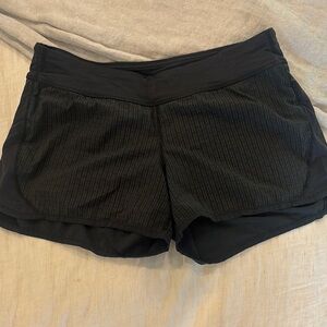 Lululemon running shorts 
Size 4
Black with tiny black polka dots